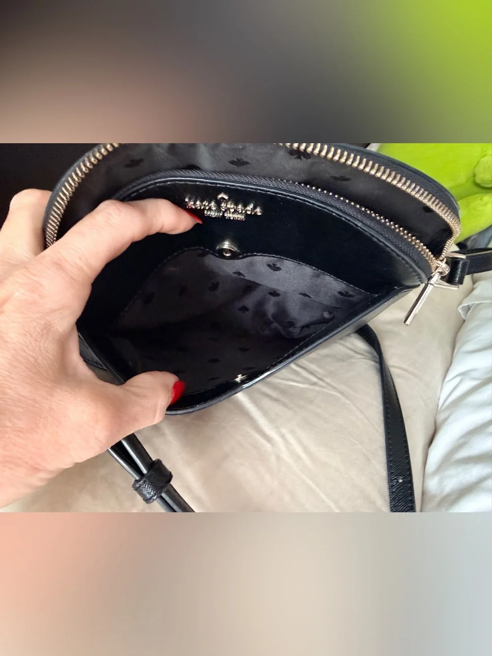 Kate Spade New York Payton Dome Crossbody in black saffiano leather.